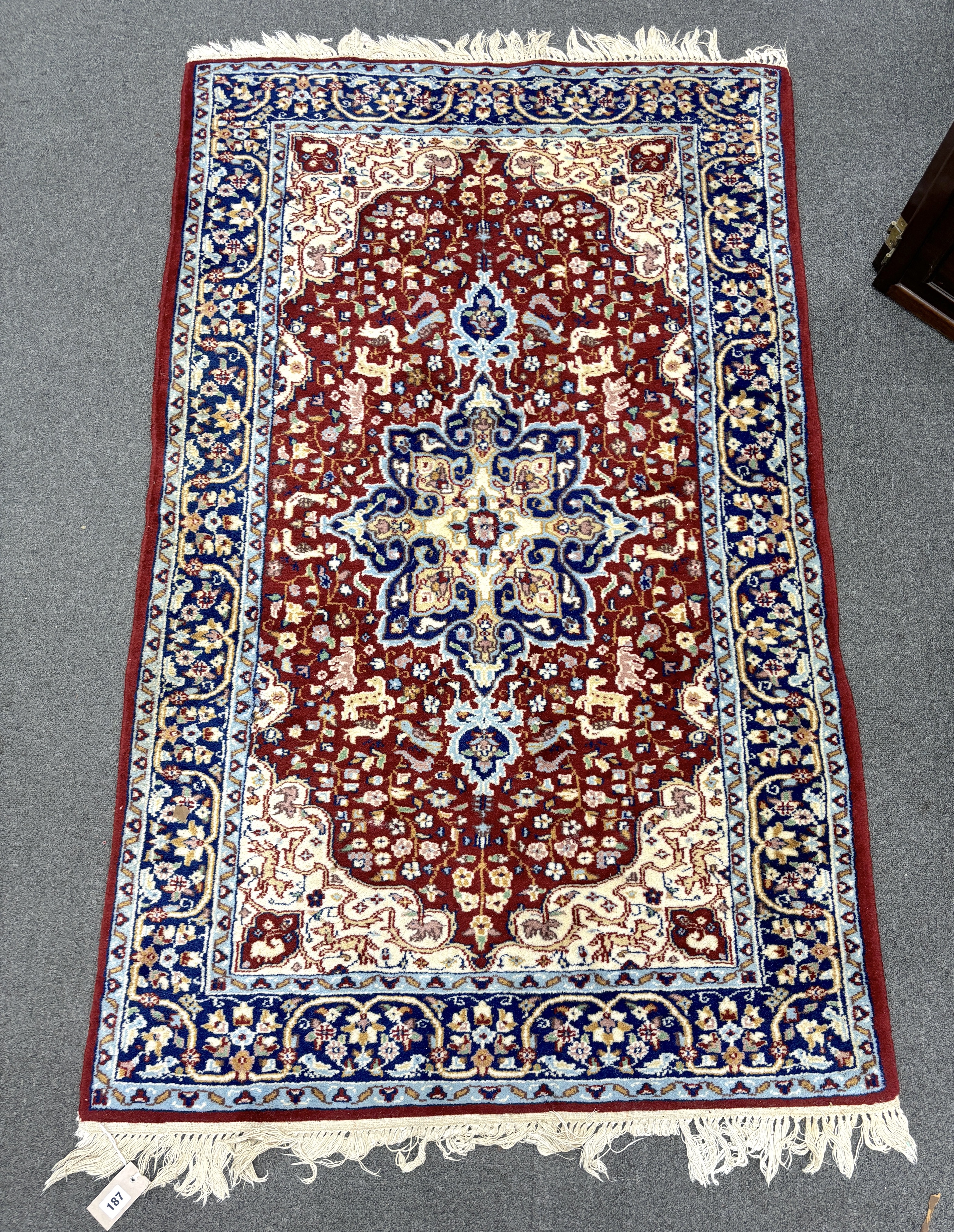 A North West Persian red ground rug, 150 x 94cm